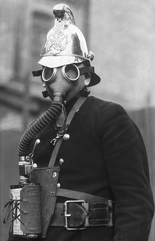 Fireman wearing Gas Mask c1936